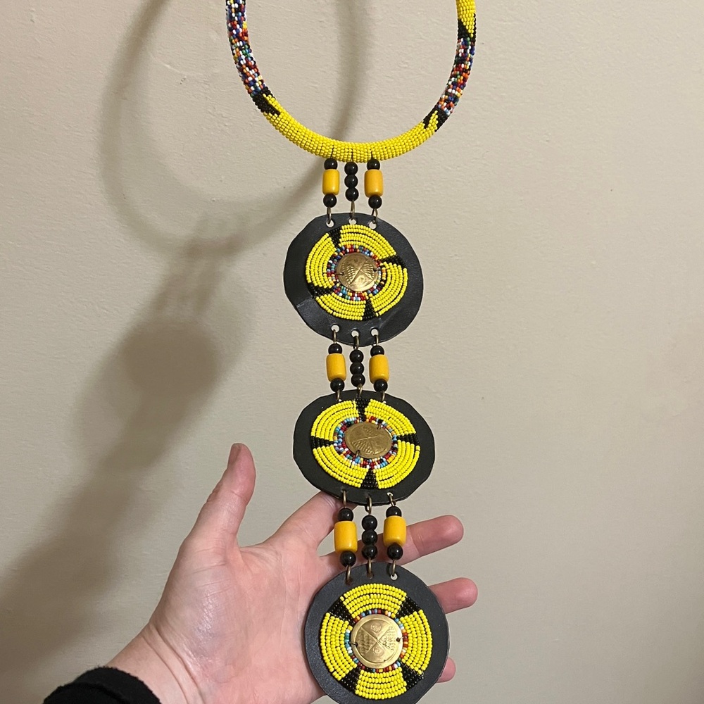 beaded necklace yellow and black glass beads,hand carved brass,leather